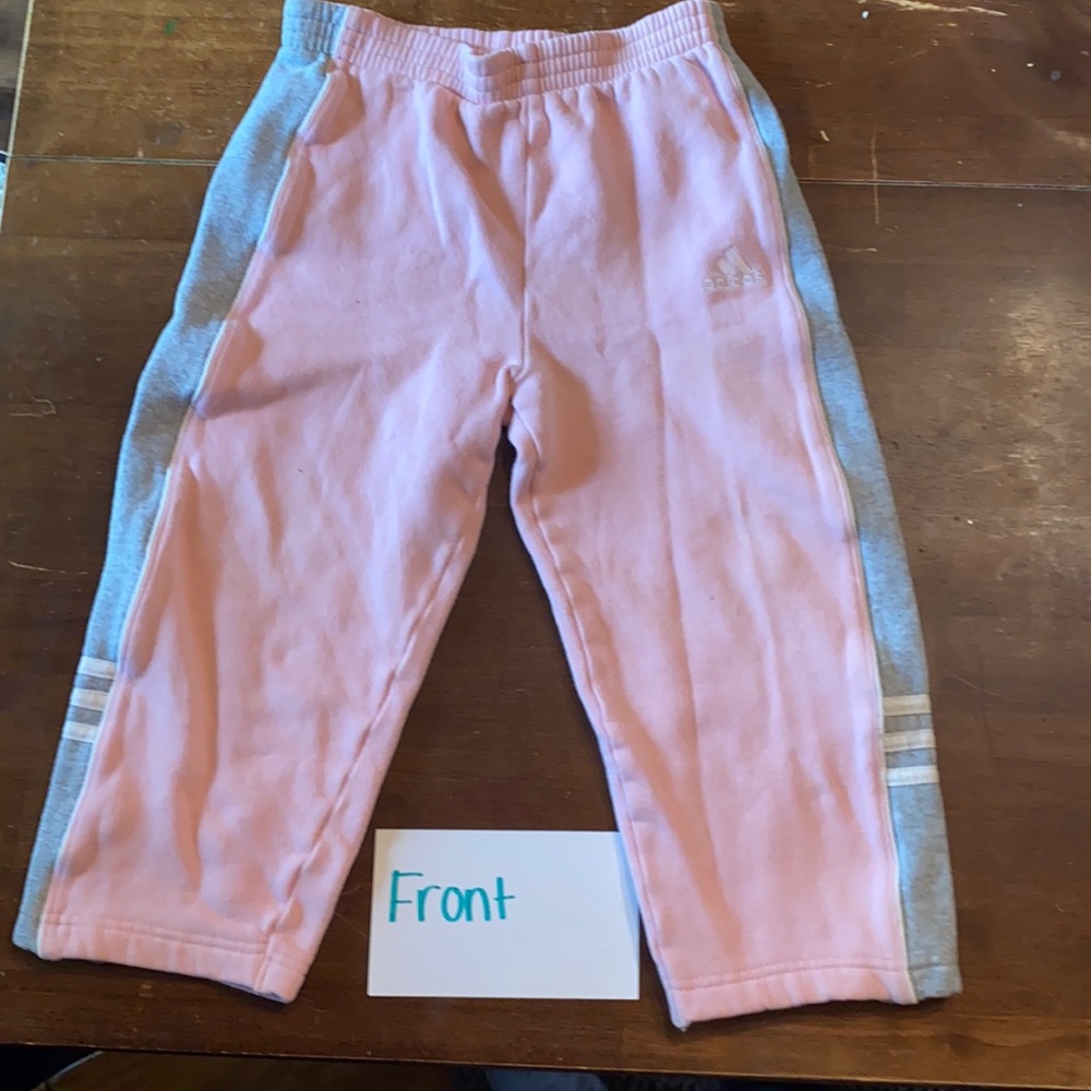 Pink and gray adidas children’s sweatpants